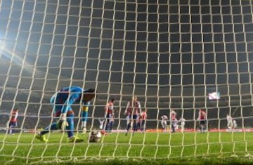 Paraguay's goalkeeper Justo Villar picks up the ball after being scored on during the Copa America third place football match against Peru in Concepcion, Chile on July 3, 2015.  AFP PHOTO / LUIS ACOSTA