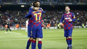 Barcelona's Antoine Griezmann, foreground, celebrates with Luis Suarez and Lionel Messi, right, after scoring the opening goal during a Spanish La Liga soccer match between Barcelona and Mallorca at Camp Nou stadium in Barcelona, Spain, Saturday, Dec