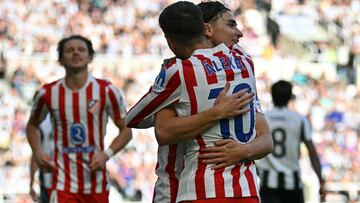 Atletico Madrid's Argentinian striker #19 Julian Alvarez (R) celebrates with Atletico Madrid's Spanish midfielder #10 Alex Baena after scoring the opening goal of the pre-season friendly football match between Newcastle United and Atletico Madrid at St James' Park in Newcastle-upon-Tyne, north east England on August 9, 2025. (Photo by ANDY BUCHANAN / AFP)