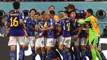 DOHA, QATAR - NOVEMBER 23: Ritsu Doan of Japan celebrates scoring his team's first goal with his team-mates during the FIFA World Cup Qatar 2022 Group E match between Germany and Japan at Khalifa International Stadium on November 23, 2022 in Doha, Qatar. (Photo by Chris Brunskill/Fantasista/Getty Images)