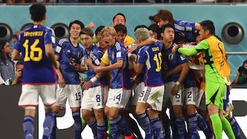 DOHA, QATAR - NOVEMBER 23:   Ritsu Doan of Japan celebrates scoring his team's first goal with his team-mates during the FIFA World Cup Qatar 2022 Group E match between Germany and Japan at Khalifa International Stadium on November 23, 2022 in Doha, Qatar. (Photo by Chris Brunskill/Fantasista/Getty Images)