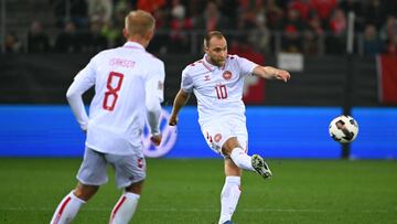 Denmark's midfielder #10 Christian Eriksen (R) passes the ball during the UEFA Nations League, League A, Group A4 football match between Switzerland and Denmark at The Kybunpark in St Gallen on October 15, 2024. (Photo by Fabrice COFFRINI / AFP)
