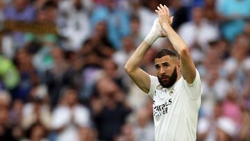 (FILES) Real Madrid's French forward Karim Benzema applauds as he is substituted during the Spanish league football match between Real Madrid CF and Athletic Club Bilbao at the Santiago Bernabeu stadium in Madrid on June 4, 2023. Real Madrid's Ballon d'Or winner Karim Benzema has signed to join Saudi Arabia's Al-Ittihad for three years starting next season, a source in the Jeddah-based club told AFP on June 6. (Photo by Pierre-Philippe MARCOU / AFP)