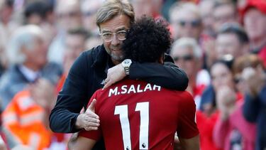Liverpool's Mohamed Salah is hugged by manager Jürgen Klopp as he is substituted against Brighton & Hove Albion.