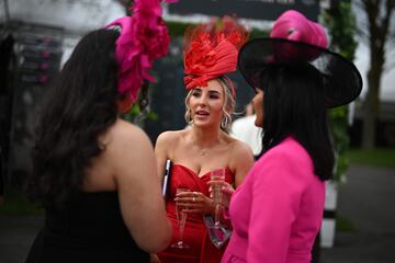 Racegoers attend the second day of the Grand National Festival horse race meeting at Aintree Racecourse in Liverpool, north-west England, on April 12, 2024. (Photo by Oli SCARFF / AFP)