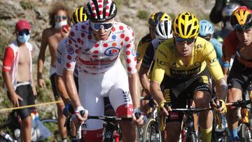 Cycling - Tour de France - Stage 18 - Meribel to La Roche-sur-Foron - France - September 17, 2020. UAE Team Emirates rider Tadej Pogacar of Slovenia, wearing the polka-dot jersey, and Team Jumbo-Visma rider Primoz Roglic of Slovenia, wearing the overall leader's yellow jersey, in action. REUTERS/Benoit Tessier