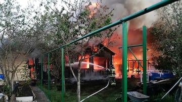 A firefighter works outside a burning house while putting out a fire following what local authorities called a Ukrainian drone attack on a settlement, in the course of Russia-Ukraine conflict in the Moscow region, Russia, in this picture published May 28, 2025. Governor of Moscow Region Andrei Vorobyov via Telegram/Handout via REUTERS ATTENTION EDITORS - THIS IMAGE HAS BEEN SUPPLIED BY A THIRD PARTY. NO RESALES. NO ARCHIVES. MANDATORY CREDIT.