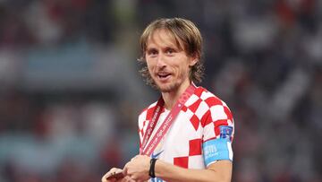 DOHA, QATAR - DECEMBER 17: Luka Modric of Croatia celebrates with their FIFA World Cup Qatar 2022 third placed medal after the team's victory during the FIFA World Cup Qatar 2022 3rd Place match between Croatia and Morocco at Khalifa International Stadium on December 17, 2022 in Doha, Qatar. (Photo by Catherine Ivill/Getty Images)