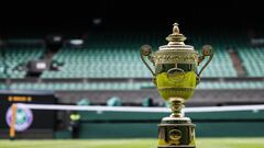 The Gentlemen's Singles Championship trophy is displayed on the grass of Center Court during an arranging organised for the filming of the trophies prior to the start of the 2023 Wimbledon Championships at The All England Tennis Club in Wimbledon, southwest London, on July 2, 2023. (Photo by Adrian DENNIS / AFP) / RESTRICTED TO EDITORIAL USE
