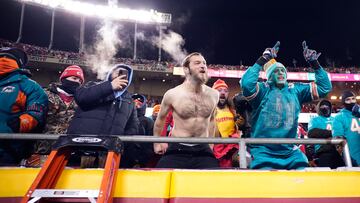 Jan 13, 2024; Kansas City, Missouri, USA; Kansas City Chiefs and Miami Dolphins cheer in the cold weather during the second half of the 2024 AFC wild card game at GEHA Field at Arrowhead Stadium. Mandatory Credit: Jay Biggerstaff-USA TODAY Sports