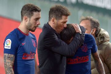 Atlético Madrid coach Diego Simeone kisses Argentine forward Angel Correa at the end of the match against Real Betis.