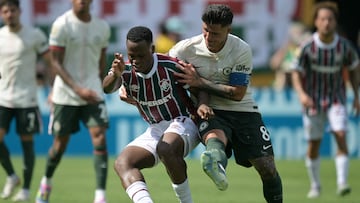 Fluminense's Colombian midfielder #21 Jhon Arias and Chelsea's Argentinian midfielder #08 Enzo Fernandez fight for the ball during the FIFA Club World Cup 2025 semifinal football match between Brazil's Fluminense and England's Chelsea at the MetLife stadium in East Rutherford, New Jersey on July 8, 2025. (Photo by JUAN MABROMATA / AFP)