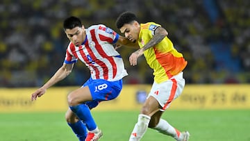 BARRANQUILLA, COLOMBIA - MARCH 25: Diego Gómez of Paraguay and Luis Diaz of Colombia battle for the ball during the South of American FIFA World Cup 2026 Qualifier between Colombia and Paraguay at Roberto Melendez Metropolitan Stadium on March 25, 2025 in Barranquilla, Colombia. (Photo by Gabriel Aponte/Getty Images)