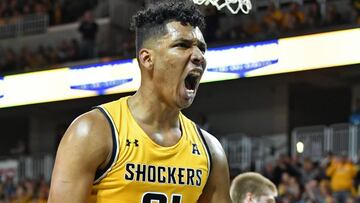 WICHITA, KS - DECEMBER 14:  Jaime Echenique #21 of the Wichita State Shockers reacts after scoring a basket against  the Oklahoma Sooners during the first half on December 14, 2019 at Intrust Bank Arena in Wichita, Kansas.  (Photo by Peter G. Aiken/Getty Images)