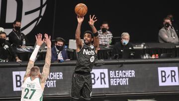 Mar 11, 2021; Brooklyn, New York, USA; Brooklyn Nets guard Kyrie Irving (11) shoots a three point shot in the third quarter against the Boston Celtics at Barclays Center. Mandatory Credit: Wendell Cruz-USA TODAY Sports