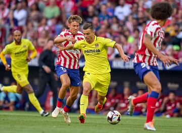 Giovani Lo Celso y Marcos Llorente.