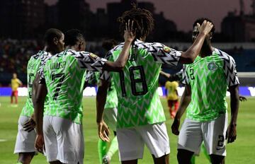 Nigeria's forward Alex Iwobi (C) celebrates his goal with teammates during the 2019 Africa Cup of Nations (CAN) Round of 16 football match between Nigeria and Cameroon at the Alexandria Stadium in the Egyptian city on July 6, 2019. (Photo by JAVIER SORIAN