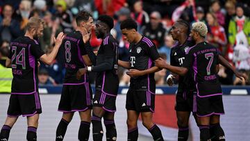 (L-R) Bayern Munich's Austrian midfielder Konrad Laimer, Bayern Munich's German midfielder Leon Goretzka, Bayern Munich's Canadian defender Alphonso Davies, Bayern Munich's German midfielder Jamal Musiala, Bayern Munich's French striker Mathys Tel and Bayern Munich's midfielder Serge Gnabry celebrate after the second goal for Munich during the friendly football match Bayern Munich v AS Monaco in Unterhaching near Munich, southern Germany, on August 7, 2023. (Photo by Christof STACHE / AFP)