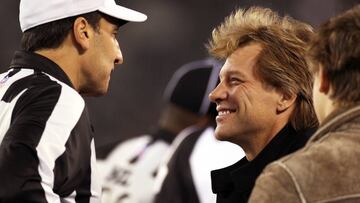 EAST RUTHERFORD - NOVEMBER 13: Singer Jon BonJovi, right, chats with referee Gene Steratore, left, on the sidelines before the game. The New England Patriots visited the New York Jets in a regular season NFL game at MetLife Stadium. (Photo by Jim Davis/Th