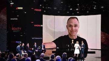 TOPSHOT - Britain&#039;s pro cyclist Christopher Froome is seen on a video screen  during the presentation of the 2018 Tour of Italy (101st Giro d&#039;Italia) cycling race, on November 29, 2017 in Milan. &quot;Ciao (hello) everyone, I&#039;m looking forward to seeing you all on the start line of the 2018 Giro d&#039;Italia,&quot; Froome said in a short video message played during the 2018 route presentation ceremony in Milan. / AFP PHOTO / MARCO BERTORELLO