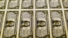 FILE PHOTO: U.S. dollar bills are seen on a light table at the Bureau of Engraving and Printing in Washington, November 14, 2014. REUTERS/Gary Cameron/File Photo/File Photo