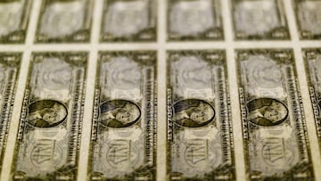 FILE PHOTO: U.S. dollar bills are seen on a light table at the Bureau of Engraving and Printing in Washington, November 14, 2014. REUTERS/Gary Cameron/File Photo/File Photo