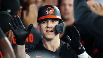 TORONTO, ONTARIO - MARCH 27: Tyler O'Neill #9 of the Baltimore Orioles celebrates with teammates in the dugout after hitting a three-run home run against the Toronto Blue Jays during the third inning on Opening Day at Rogers Centre on March 27, 2025 in Toronto, Ontario. Vaughn Ridley/Getty Images/AFP (Photo by Vaughn Ridley / GETTY IMAGES NORTH AMERICA / Getty Images via AFP)