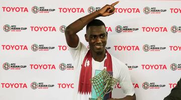 Qatar's Almoez Ali poses with the trophy for most valuable player of the tournament after winning the Asian Cup