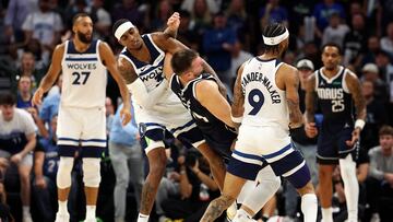 Jaden McDaniels #3 of the Minnesota Timberwolves intentionally fouls Luka Doncic #77 of the Dallas Mavericks in the fourth quarter at Target Center on October 29, 2024 in Minneapolis, Minnesota. The Mavericks defeated the Timberwolves 120-114.