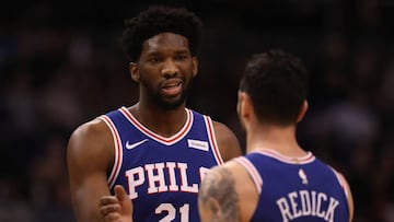 PHOENIX, AZ - DECEMBER 31: Joel Embiid #21 of the Philadelphia 76ers high fives JJ Redick #17 after scoring against the Phoenix Suns during the first half of the NBA game at Talking Stick Resort Arena on December 31, 2017 in Phoenix, Arizona. NOTE TO USER: User expressly acknowledges and agrees that, by downloading and or using this photograph, User is consenting to the terms and conditions of the Getty Images License Agreement.   Christian Petersen/Getty Images/AFP
 == FOR NEWSPAPERS, INTERNET, TELCOS &amp; TELEVISION USE ONLY ==