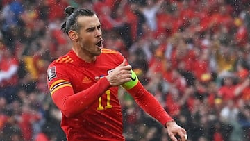 Wales' striker Gareth Bale celebrates after scoring the opening goal during the FIFA World Cup 2022 play-off final qualifier football match between Wales and Ukraine at the Cardiff City Stadium in Cardiff, south Wales, on June 5, 2022. (Photo by Paul