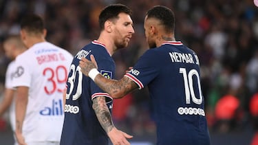 Paris Saint-Germain's Brazilian forward Neymar (R) is congratulated by Paris Saint-Germain's Argentinian forward Lionel Messi after scoring on a penalty during the French L1 football match between Paris-Saint Germain (PSG) and Olympique Lyonnais