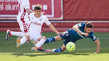 ALBACETE, SPAIN - APRIL 04: Oscar Gil of RCD Espanyol is fouled by Manuel Fuster of Albacete BP during the Liga Smartbank match between Albacete BP and RCD Espanyol de Barcelona at Estadio Carlos Belmonte on April 04, 2021 in Albacete, Spain. Sporting sta