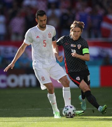 Modric y Busquets.