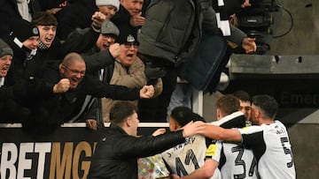 Newcastle United's English midfielder #67 Lewis Miley (obscured) celebrates scoring their second goal to take the lead 2-1 with team-mates during the English League Cup quarter-final football match between Newcastle United and Fulham at St James' Park in Newcastle-upon-Tyne, north east England on December 17, 2025. (Photo by Oli SCARFF / AFP) / RESTRICTED TO EDITORIAL USE. No use with unauthorized audio, video, data, fixture lists, club/league logos or 'live' services. Online in-match use limited to 120 images. An additional 40 images may be used in extra time. No video emulation. Social media in-match use limited to 120 images. An additional 40 images may be used in extra time. No use in betting publications, games or single club/league/player publications. /
