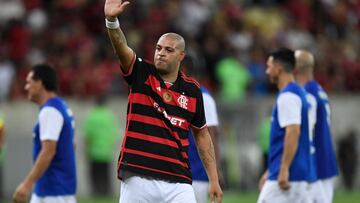 Brazilian former football player Adriano waves to the crowd during his friendly farewell match with legends of Brazil's Flamengo and Italy's Inter Milan at Maracana Stadium in Rio de Janeiro on December 15, 2024. (Photo by Daniel RAMALHO / AFP)