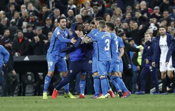 Valencia and Getafe players were involved in a brawl at the end of their Copa del Rey match that saw Valencia score twice in 45 seconds to go through.