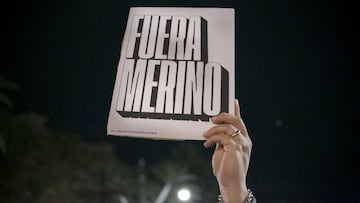 BARCELONA, SPAIN - NOVEMBER 13: A protester holds a poster against the new president of Peru, Manuel Merino on November 13, 2020 in Barcelona, Spain. Since Manuel Merino de Lama, who was president of the National Congress, replaced the former president Martin Vizcarra as head of state, there have been demonstrations of rejection of this change of government inside and outside the country 5 months before the general elections. (Photo by Manuel Medir/Getty Images)