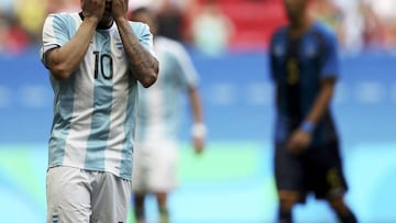 &Aacute;ngel Correa covers his face after missing a penalty.   