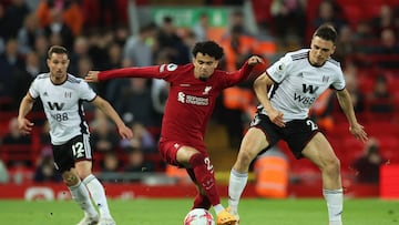 Soccer Football - Premier League - Liverpool v Fulham - Anfield, Liverpool, Britain - May 3, 2023 Liverpool's Luis Diaz in action with Fulham's Joao Palhinha and Cedric Soares REUTERS/Phil Noble EDITORIAL USE ONLY. No use with unauthorized audio, video, data, fixture lists, club/league logos or 'live' services. Online in-match use limited to 75 images, no video emulation. No use in betting, games or single club /league/player publications.  Please contact your account representative for further details.