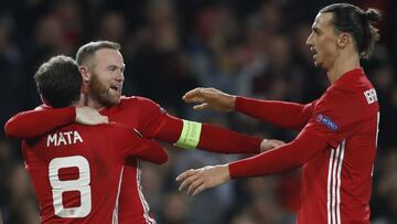 Manchester United's Juan Mata celebrates scoring their second goal with Wayne Rooney and Zlatan Ibrahimovic.