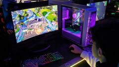 PARIS, FRANCE - NOVEMBER 03: A gamer plays a video game 
with an ARGB Grand Tower Case, Cooler Master COSMOS C700M during Paris Games Week 2022 at Parc des Expositions Porte de Versailles on November 03, 2022 in Paris, France. After two years of absence linked to the Covid-19 pandemic, Paris Games Week is making a comeback in Paris. The event celebrating video games and esports will be held from November 2 to 6, 2022. (Photo by Chesnot/Getty Images)