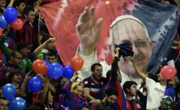 San Lorenzo supportes stand and chant slogans before the FIFA Club World Cup final football match between Real Madrid and San Lorenzo at Marrakesh stadium in Marrakesh on December 20, 2014. AFP PHOTO/ JAVIER SORIANO