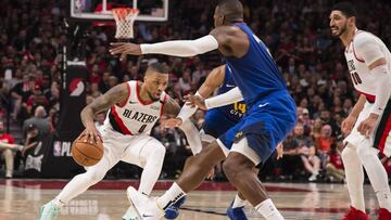 May 9, 2019; Portland, OR, USA; Portland Trail Blazers guard Damian Lillard (0) drives to the basket between Denver Nuggets guard Gary Harris (14) and forward Paul Millsap (4) during the second half in game six of the second round of the 2019 NBA Playoffs at Moda Center. The Trail Blazers beat the Nuggets 119-108. Mandatory Credit: Troy Wayrynen-USA TODAY Sports