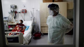 Dr. Carlos Fuentes removes one of his protective gear before leaving an Intensive Care Unit (ICU) with patients infected with coronavirus disease (COVID-19), at the Dr. Alberto Antranik Eurnekian hospital, in Ezeiza, on the outskirts of Buenos Aires, Argentina June 24, 2020. Picture taken June 24, 2020. REUTERS/Agustin Marcarian