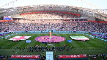 DOHA, QATAR - NOVEMBER 21: Players and match officials line up for the national anthem during the FIFA World Cup Qatar 2022 Group B match between England and IR Iran at Khalifa International Stadium on November 21, 2022 in Doha, Qatar. (Photo by Laurence Griffiths/Getty Images)