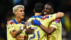 America�s Julian Andres Quinones (R) celebrates scoring the second goal of the match against Queretaro with team mates captain Henry Martin (C) and Cristian Calderon (L) during their 2024 Mexican Clausura tournament match at the Azteca stadium in Mexico City on January 20, 2024. (Photo by CARL DE SOUZA / AFP)
