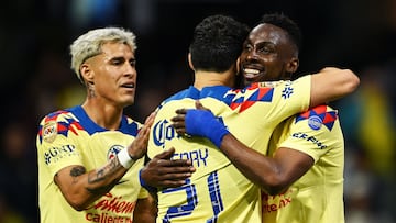 America�s Julian Andres Quinones (R) celebrates scoring the second goal of the match against Queretaro with team mates captain Henry Martin (C) and Cristian Calderon (L) during their 2024 Mexican Clausura tournament match at the Azteca stadium in Mexico City on January 20, 2024. (Photo by CARL DE SOUZA / AFP)