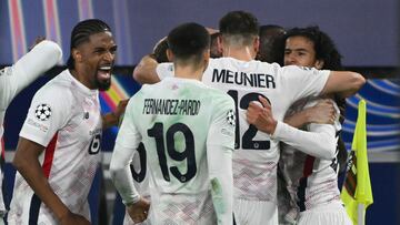 Lille's Congolese midfielder #17 Ngal'ayel Mukau (hidden) celebrates scoring his team's second goal with teammates during the UEFA Champions League football match between Bologna and Lille at the Renato Dall'Ara stadium in Bologna on November 27, 2024. (Photo by Alberto PIZZOLI / AFP)