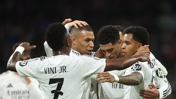 Real Madrid's Brazilian forward #11 Rodrygo (R) celebrates with teammates scoring his team's second goal during the UEFA Champions League, league phase football match between Real Madrid CF and FC Salzburg at the Santiago Bernabeu stadium in Madrid on January 22, 2025. (Photo by Pierre-Philippe MARCOU / AFP)